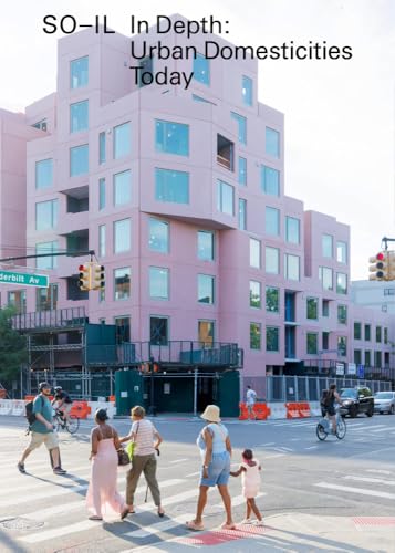 Pink, geometric apartment building with pedestrians crossing a city street.