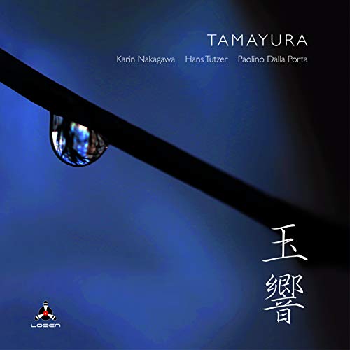 CD cover featuring a water droplet on a dark branch against a blue background.