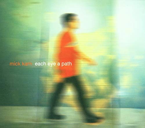 CD cover with blurred image of a person walking forward.