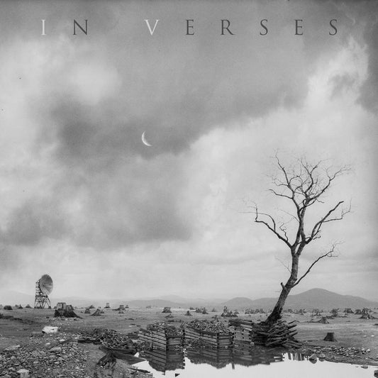 Black and white album cover with a barren landscape and crescent moon.