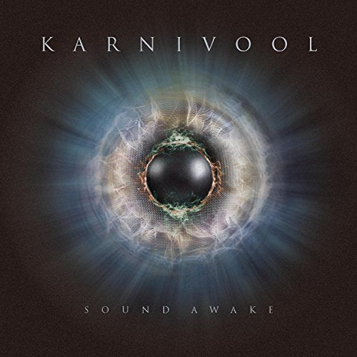 Dark album cover with glowing orb and white text reading Karnivool Sound Awake.