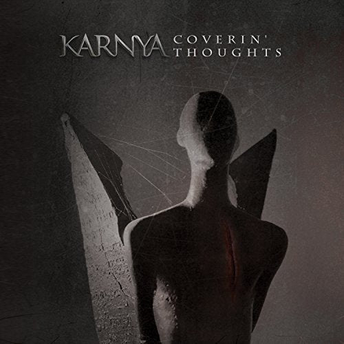 CD cover: dark, abstract figure with wings against a textured background.