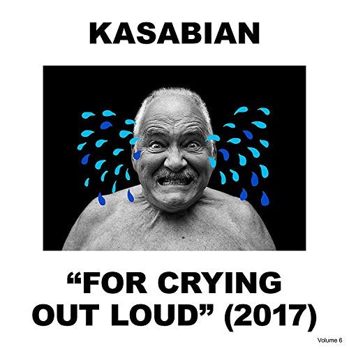 "Vinyl album cover with black and white photo of man and blue shapes."