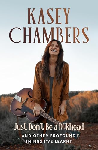 Book cover featuring Kasey Chambers smiling with a guitar, desert background.