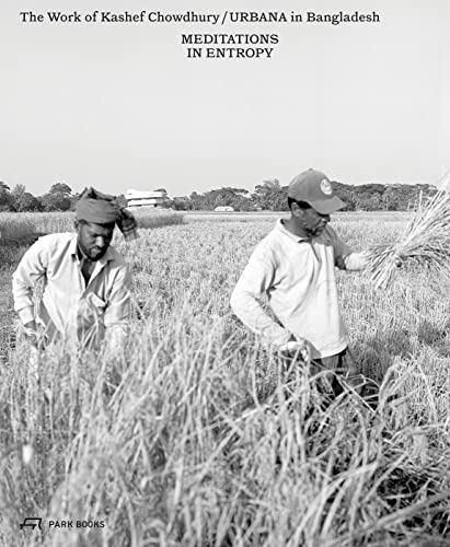 Black and white photo of two men harvesting crops in a field.