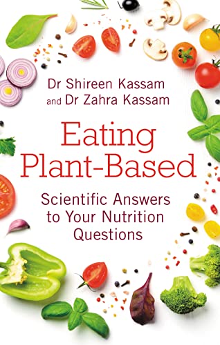 Book cover with title “Eating Plant-Based” surrounded by colorful vegetables.