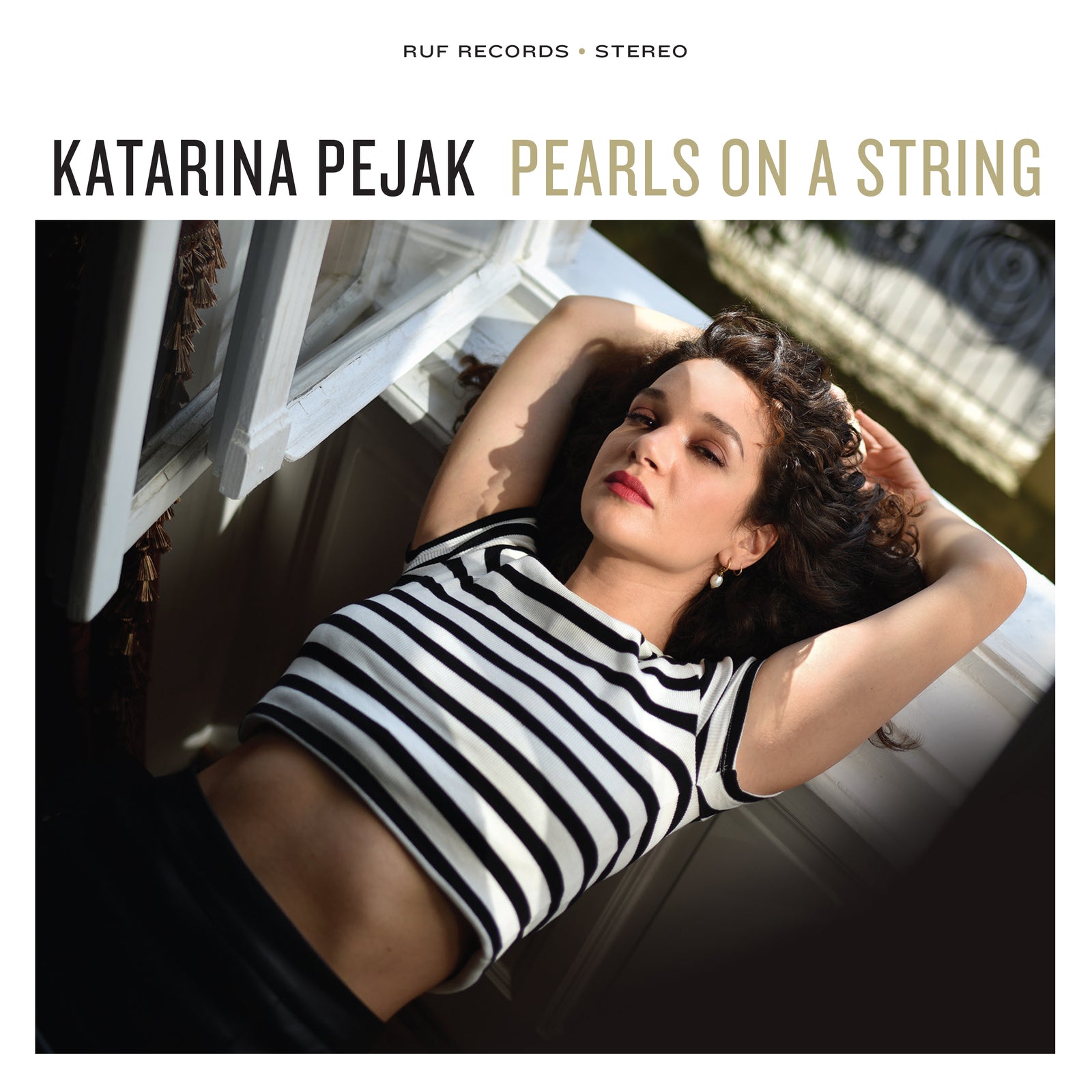 CD cover: woman lying by a window, album title "Pearls On A String".