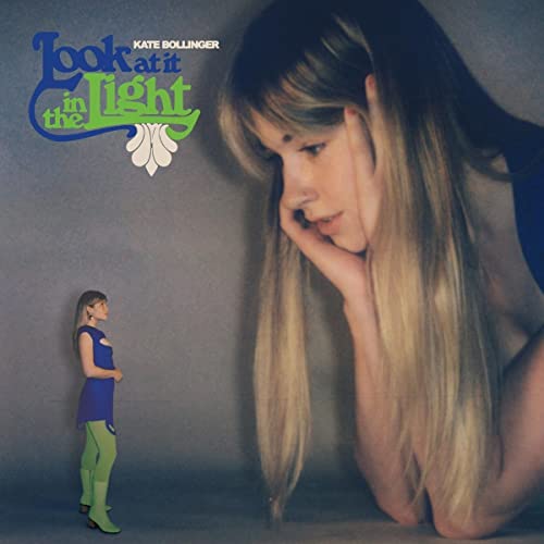 Kate Bollinger album cover: woman with long hair, miniature figure.