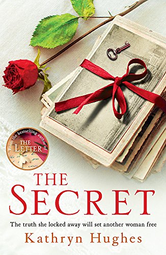 Book cover with a red rose, old photos, ribbon, and a key.