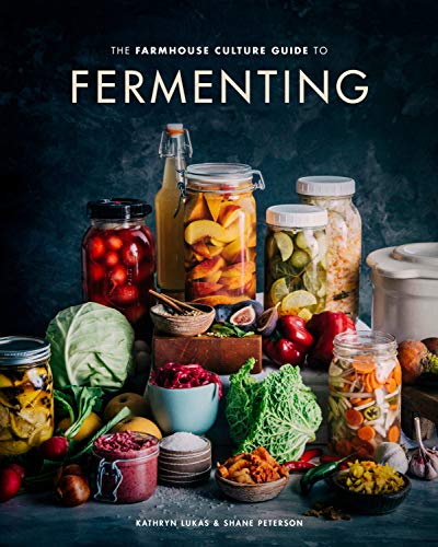 Book cover featuring jars of fermented foods and fresh produce.