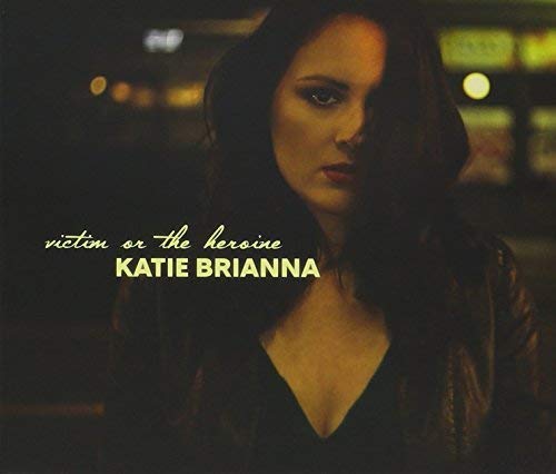CD cover featuring a portrait of singer Katie Brianna in low light.