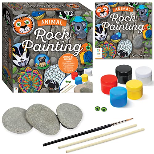Animal rock painting kit with rocks, paints, brushes, googly eyes, and instructional book.