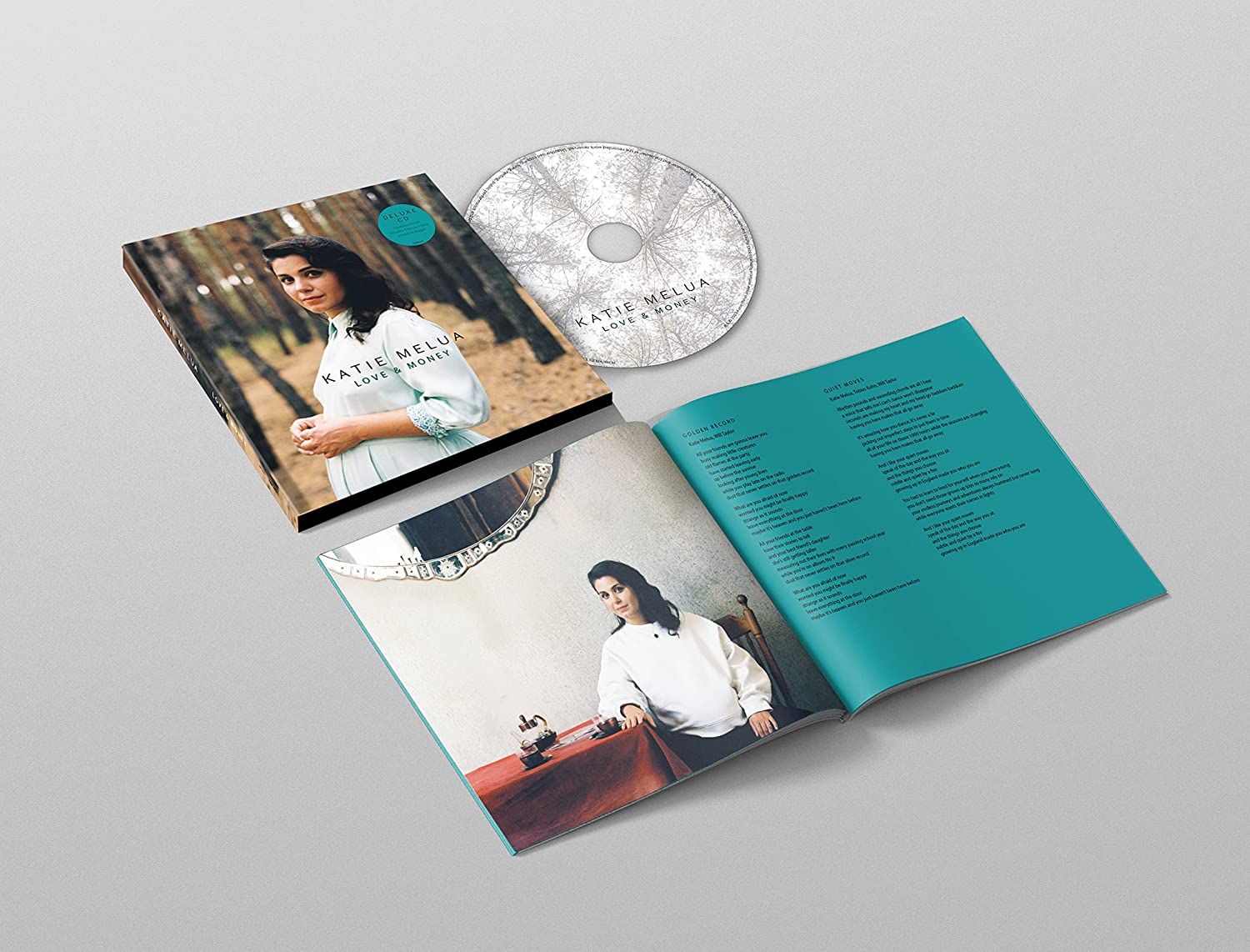 "CD case and disc with booklet featuring Katie Melua, open to a song lyrics page."