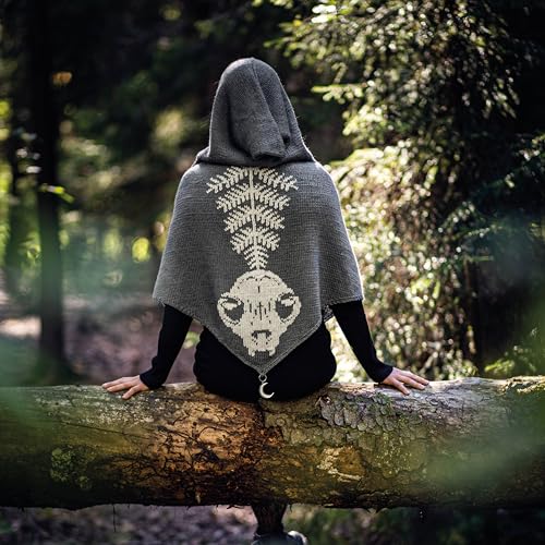A person wearing a grey hooded poncho with a white skull and fern pattern.