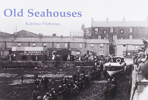 Black and white photo of a historic Seahouses harbor scene with people.