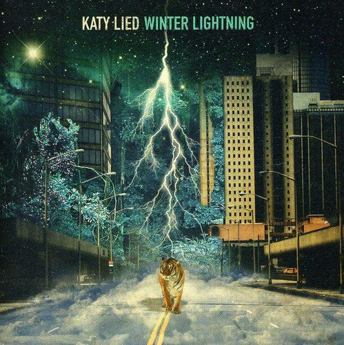 Album cover: city street with lightning, a tiger, and snowy trees.