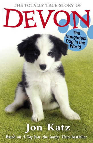 Book cover featuring a fluffy black and white puppy on grass.