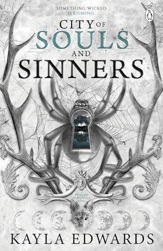 Book cover: antlers, spider, keyhole, and wolf illustration with title text.