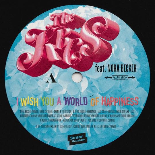 Vinyl record label with pink stylized text and blue clouds background.