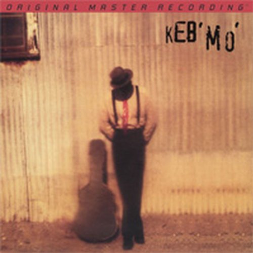 Album cover for Keb' Mo', featuring a blurred figure with a guitar.