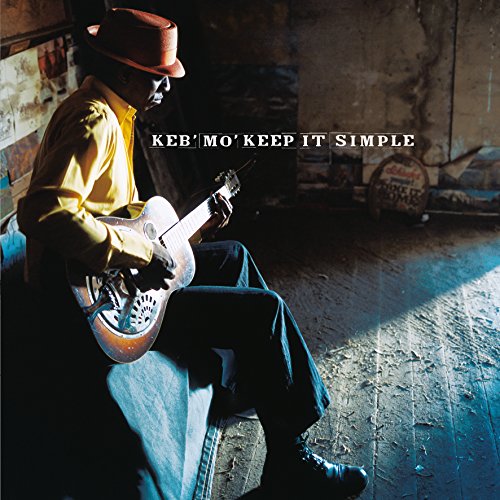 Keb Mo playing a guitar, album cover with rustic background.