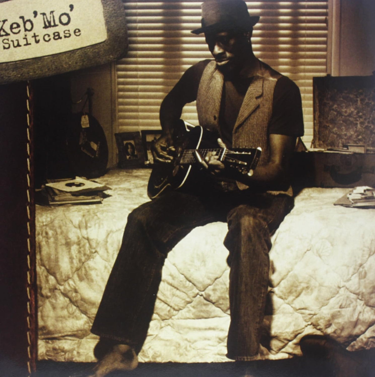 Keb' Mo' album cover: a sepia-toned photo of a musician with a guitar.