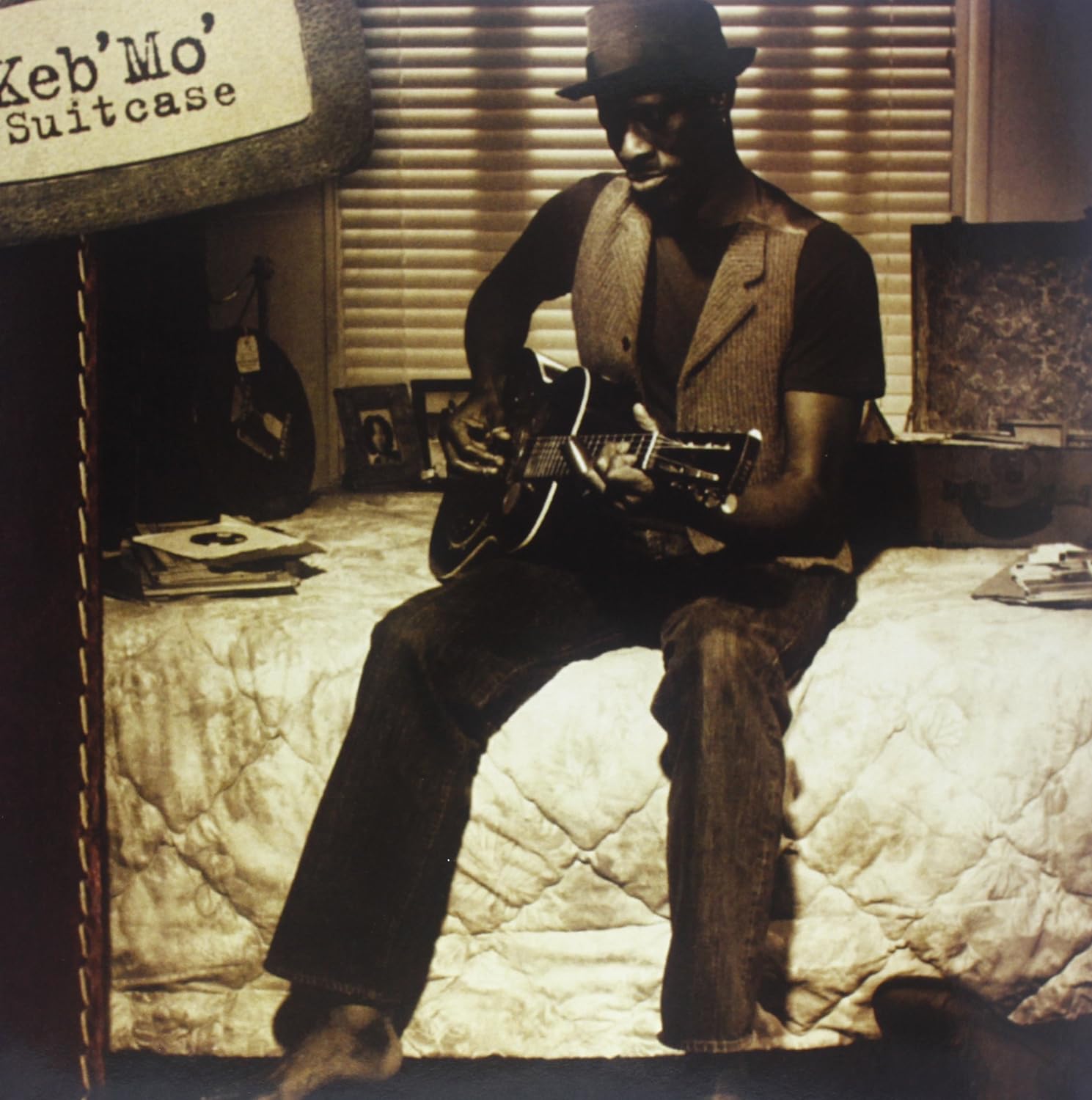 Keb' Mo' album cover: a sepia-toned photo of a musician with a guitar.