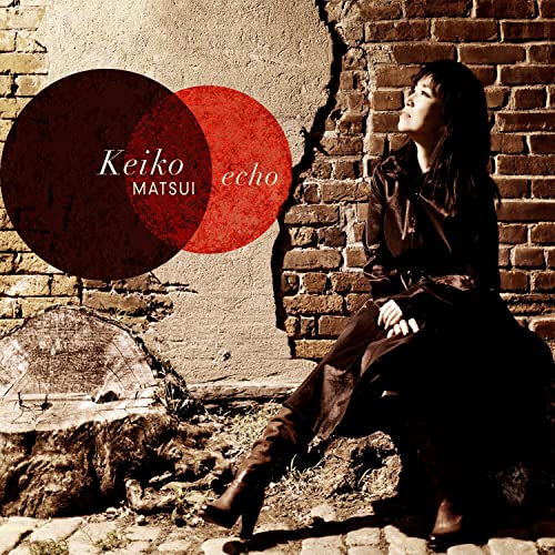 CD cover for Keiko Matsui’s “Echo” featuring a woman by a brick wall.
