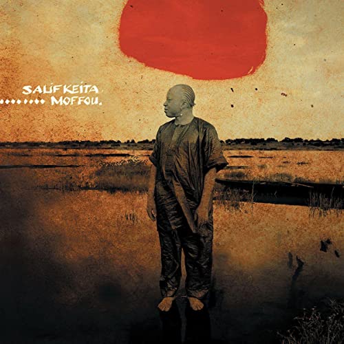 Salif Keita album cover: man standing in a marsh, red sun above.
