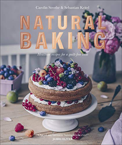Cookbook cover featuring a two-layer cake decorated with fresh berries.