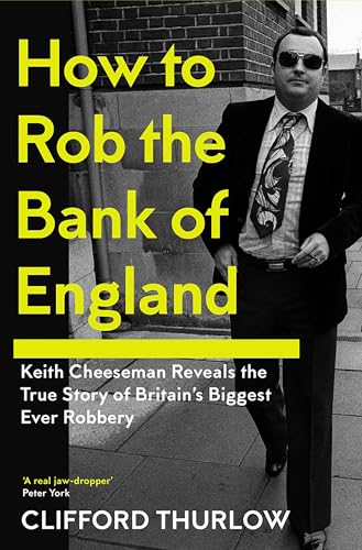 Book cover: Man in suit, tie, sunglasses, with bold yellow title text.