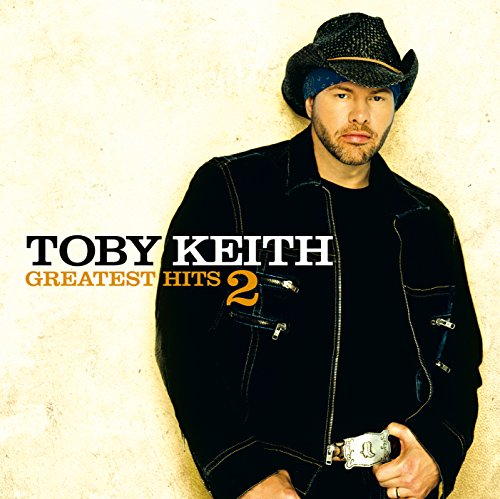 Toby Keith album cover: artist in a cowboy hat, dark jacket.