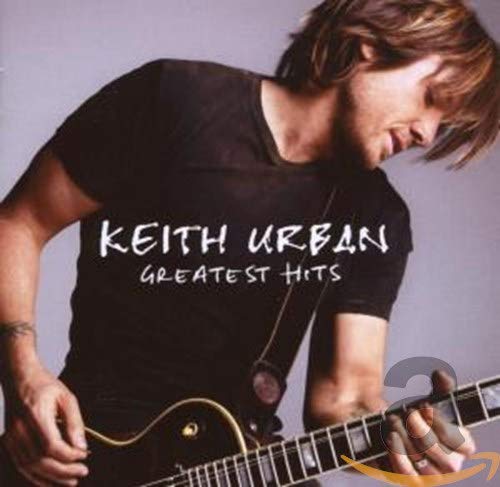 Man with guitar on music album cover, looking down, wearing black shirt.