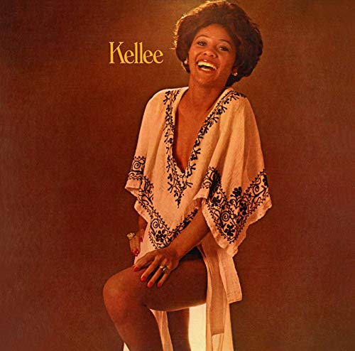 Kellee Patterson album cover: smiling Black woman in a white lace top.