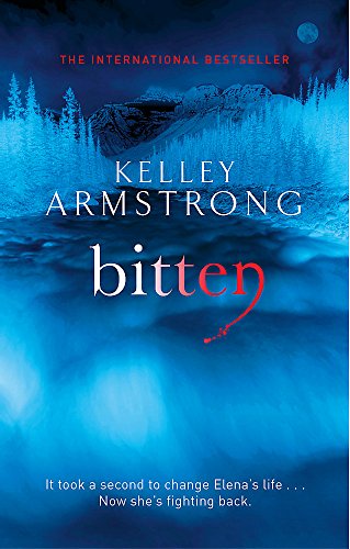 Book cover: “Bitten” by Kelley Armstrong, snowy forest, blue tones.