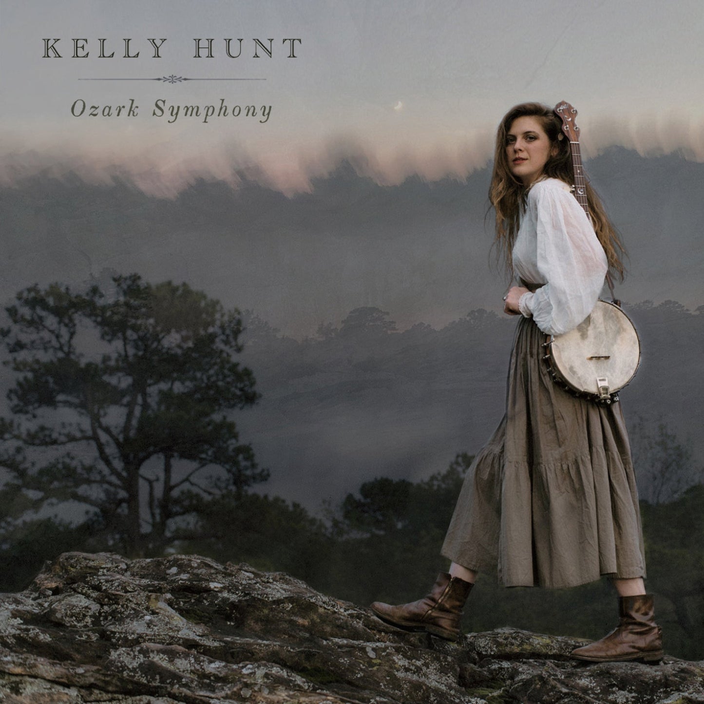Kelly Hunt album cover: woman with banjo in a misty mountain landscape.