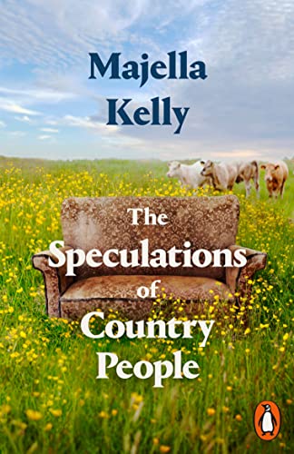 Book cover: a worn sofa in a field with cows, blue sky.