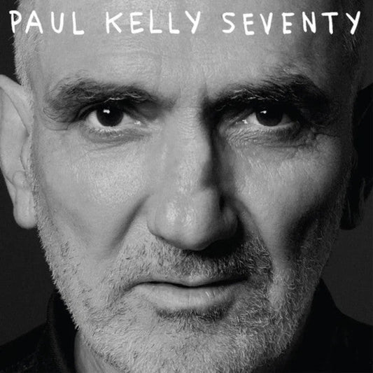 Black and white portrait of Paul Kelly, album cover for "Seventy".