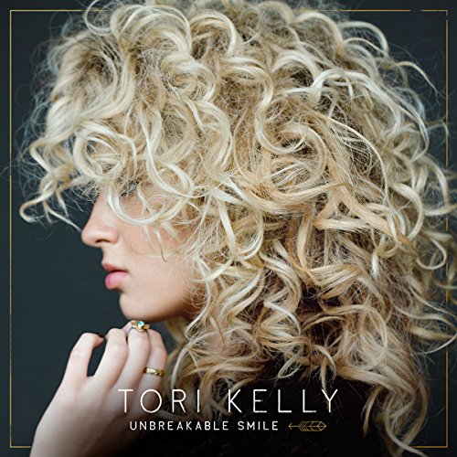 Tori Kelly album cover, close-up of woman with curly blonde hair.