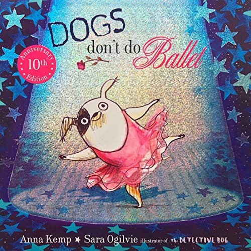 A white dog with a black ear wearing a pink tutu dances under a spotlight.