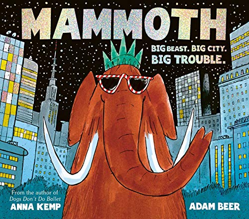 A brown mammoth wearing a Statue of Liberty crown and sunglasses in a city.