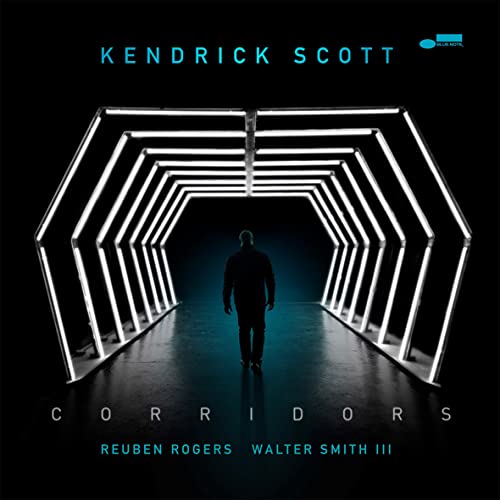 Album cover for "Corridors" featuring a figure in a glowing hexagonal tunnel.