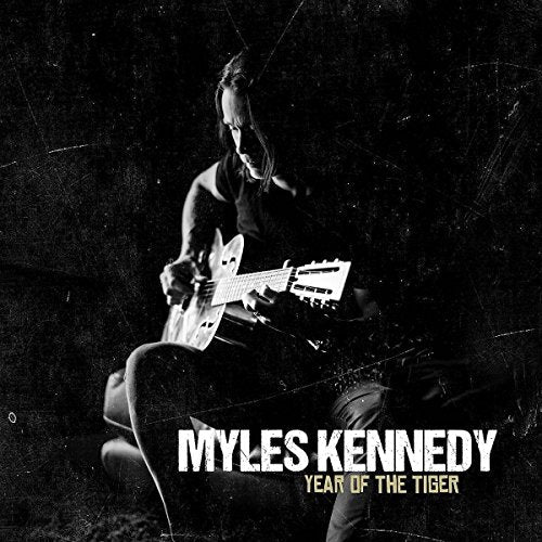 Myles Kennedy playing guitar, album cover for "Year Of The Tiger".