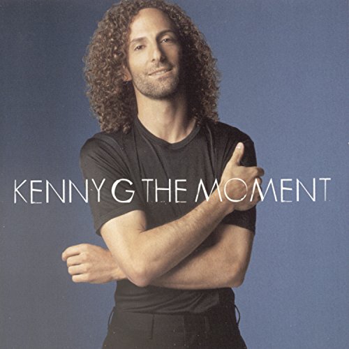 Kenny G album cover, “The Moment,” featuring a portrait of the artist.
