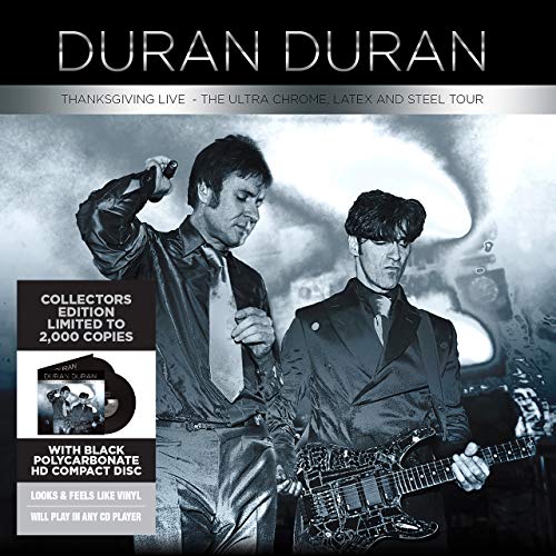 Duran Duran album cover featuring two musicians in dark suits on stage.