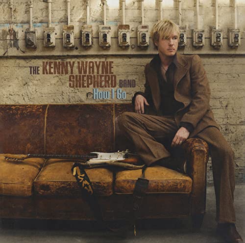 CD cover: Kenny Wayne Shepherd Band, man on a brown couch.
