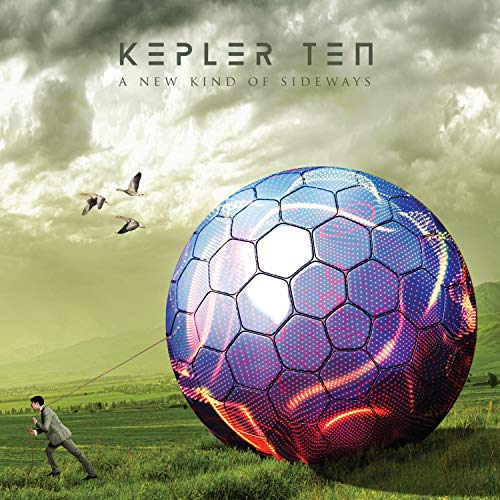 Album cover: large, patterned sphere with a man pulling a rope.