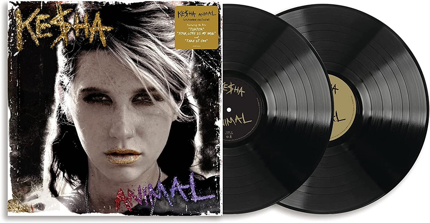 "Album cover with woman's face and two black vinyl records beside it."