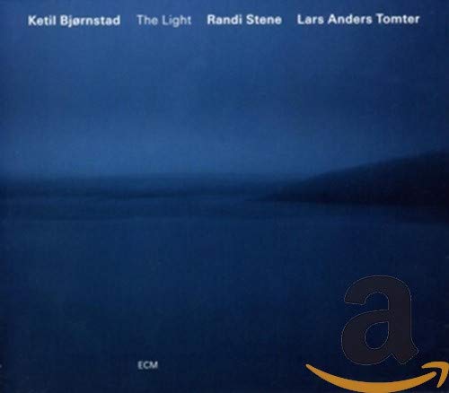 CD cover for Ketil Bjornstad’s “The Light” with a dark, blurred landscape.