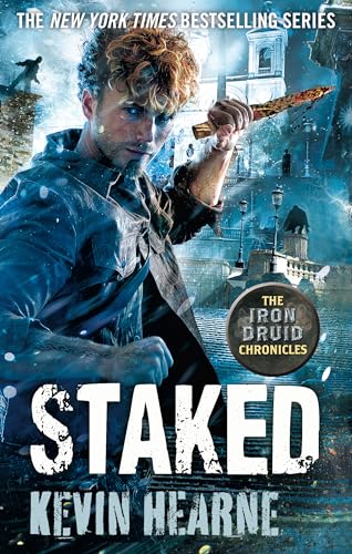 Book cover: man with sword, city background, “Staked” title text.